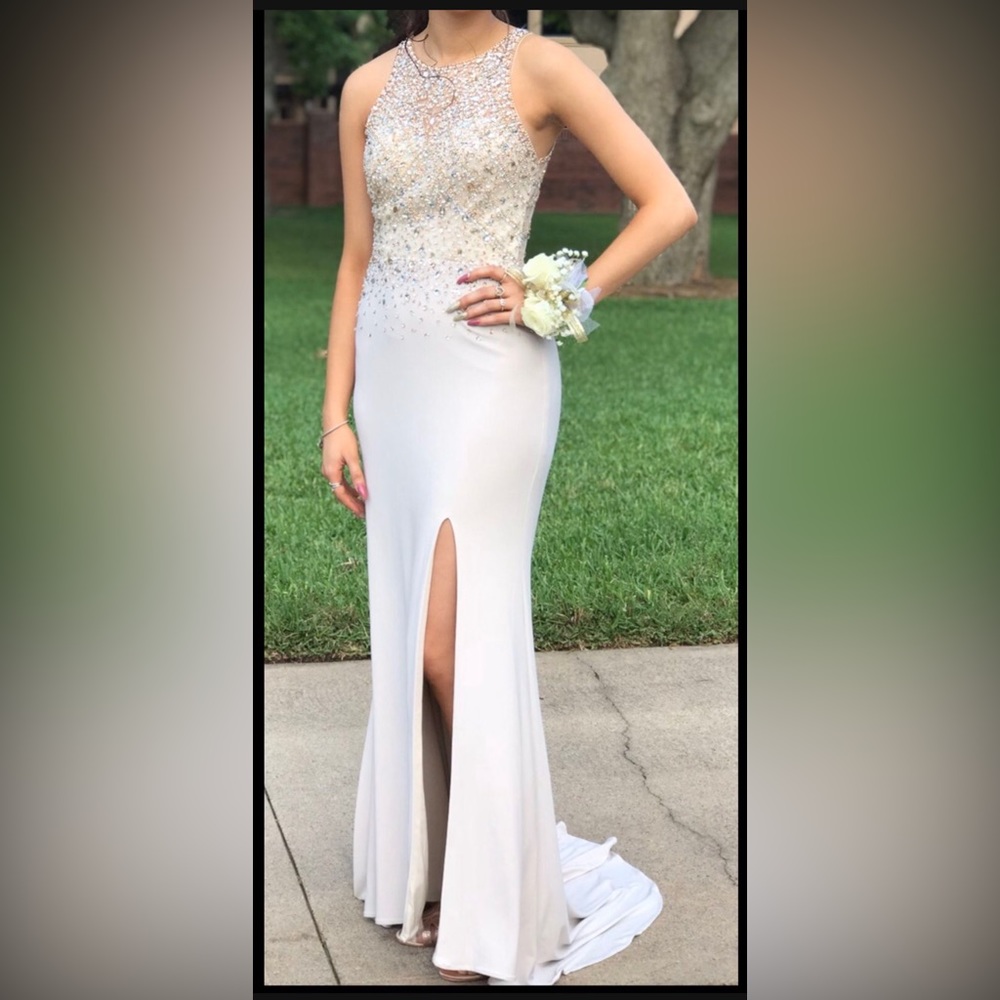 Prom/formal gown. Size 4. Cream color.  Beaded top and back.